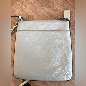 Coach adjustable crossbody bag in light blue with silver writing.